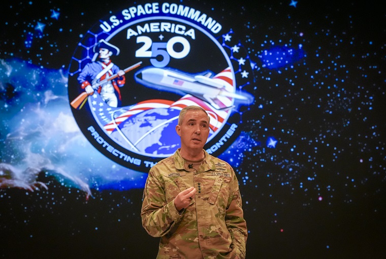 A man in front of a display
